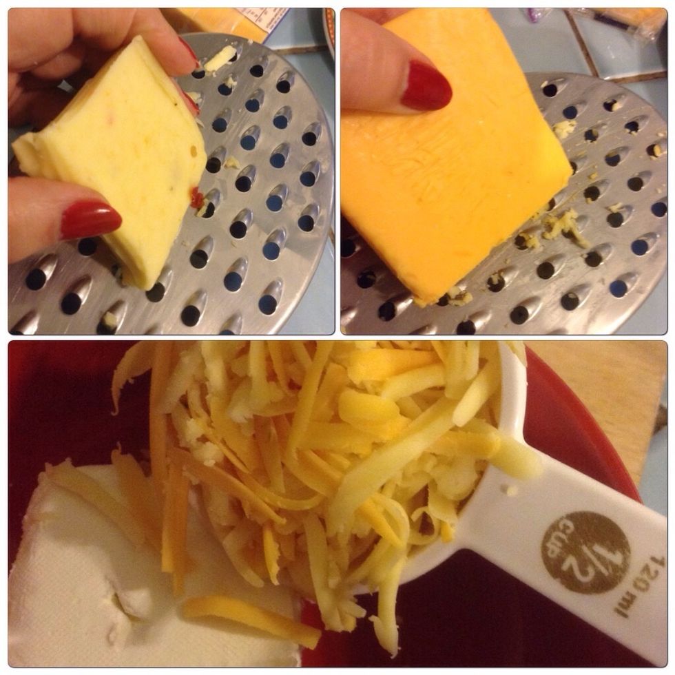 Grate cheddar cheese and add to the cream cheese.