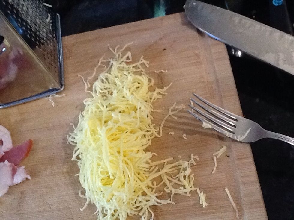 Grate cheese, approx. half a cup of cheese.