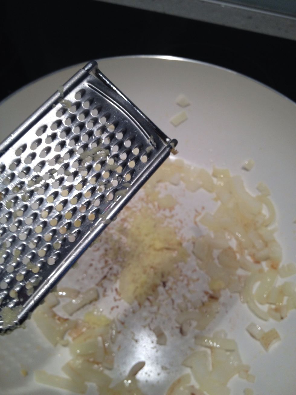 Grate ginger into pan