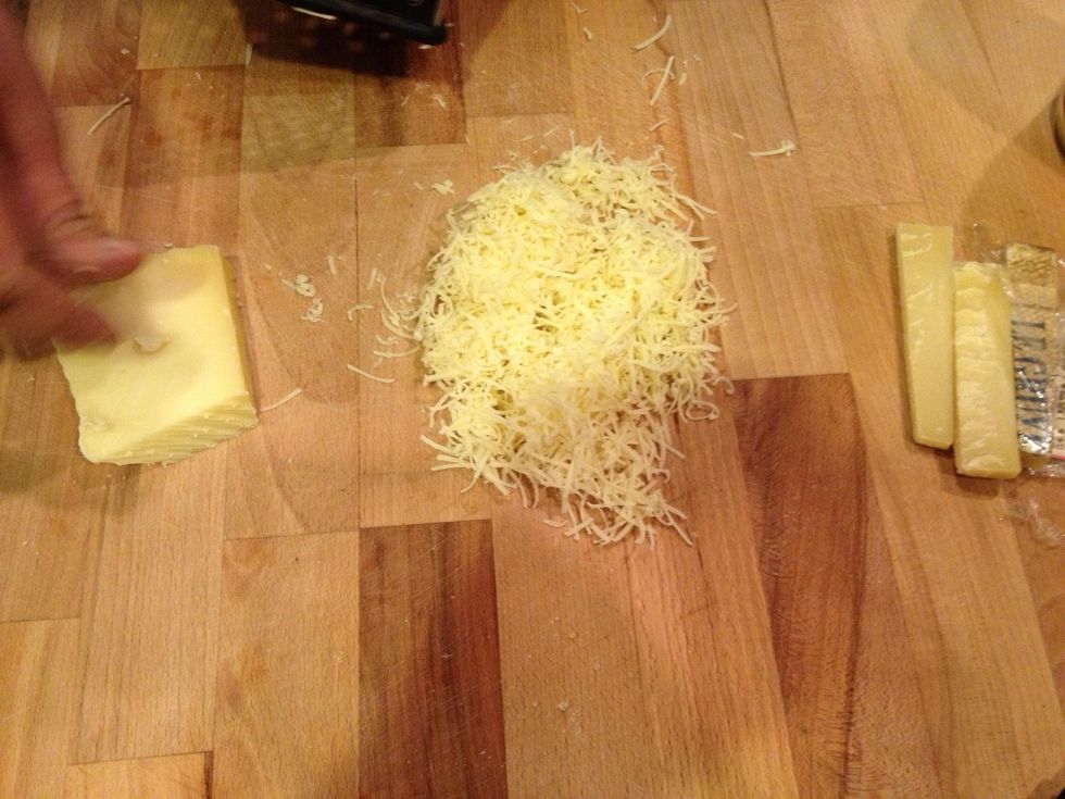 Grate gruyere cheese.