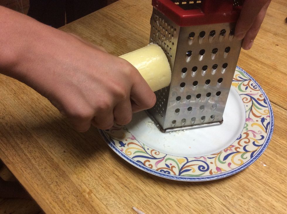 Grate half a cup of Parmesan cheese