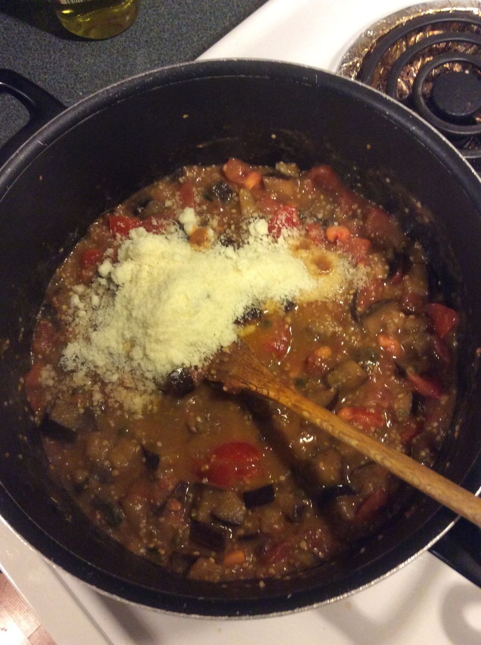 Grate in half the cheese and tear in most of the reserved basil leaves. Add a splash of extra virgin olive oil, then season to taste.