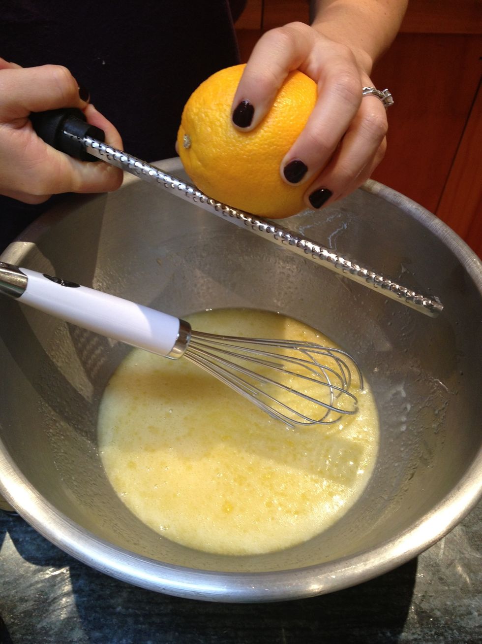 Grate in the zest of about 1/4 of an orange.