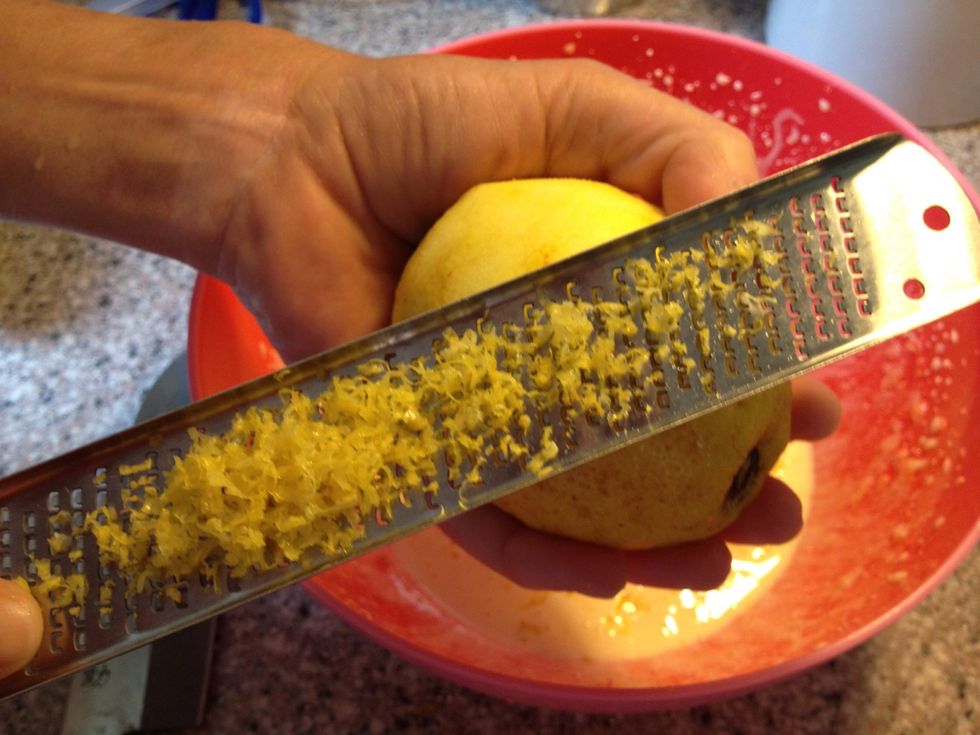 Grate lemon peel. I find it easiest to grate like this, because I can see what I'm doing , I can see the amount and I can check that I'm only getting the yellow part of the peel.