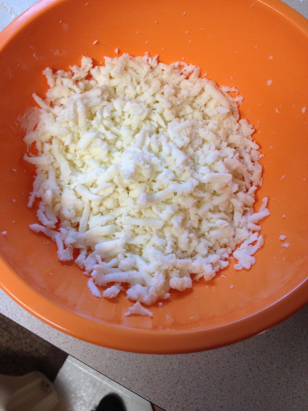 Grate mozzarella cheese