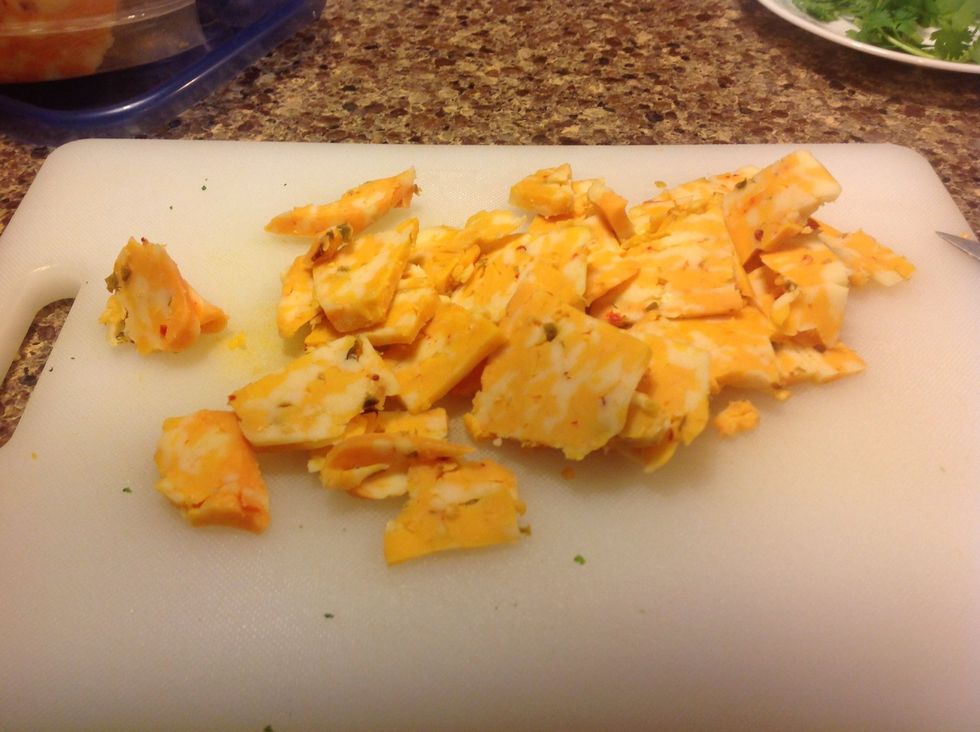 Grate or thinly slice your cheese. Sharp yellow cheeses like cheddar are best. I'm using habanero Colby jack. Told you I was spice crazy! I hate washing the grater, so I slice it instead.