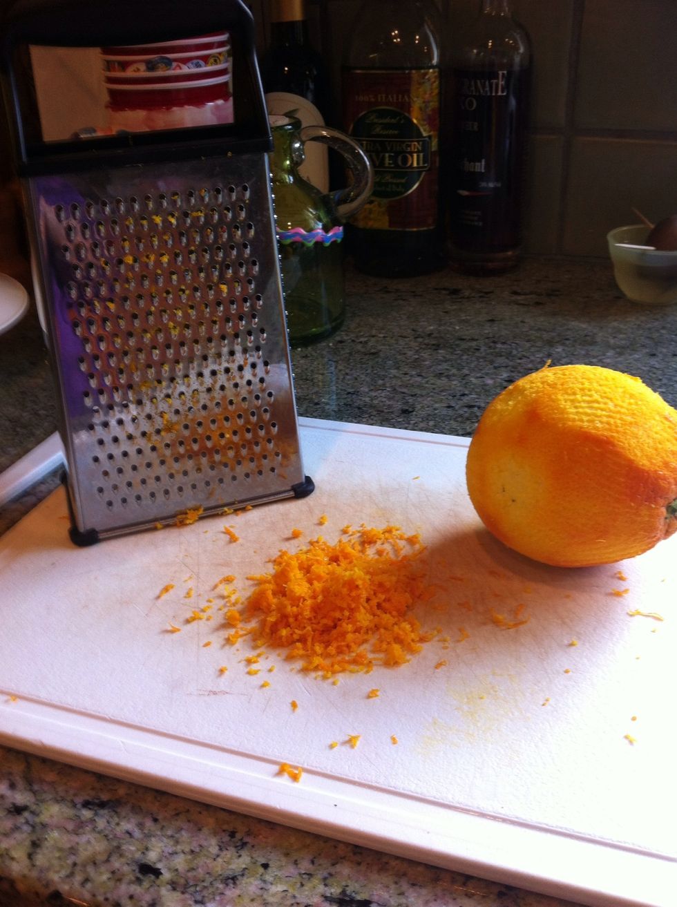 Grate orange peel for its zest.