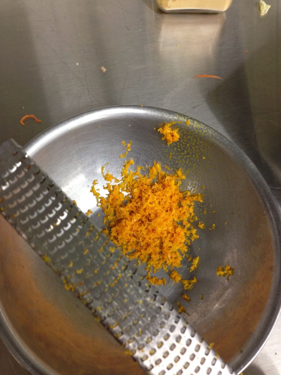 Grate orange zest.