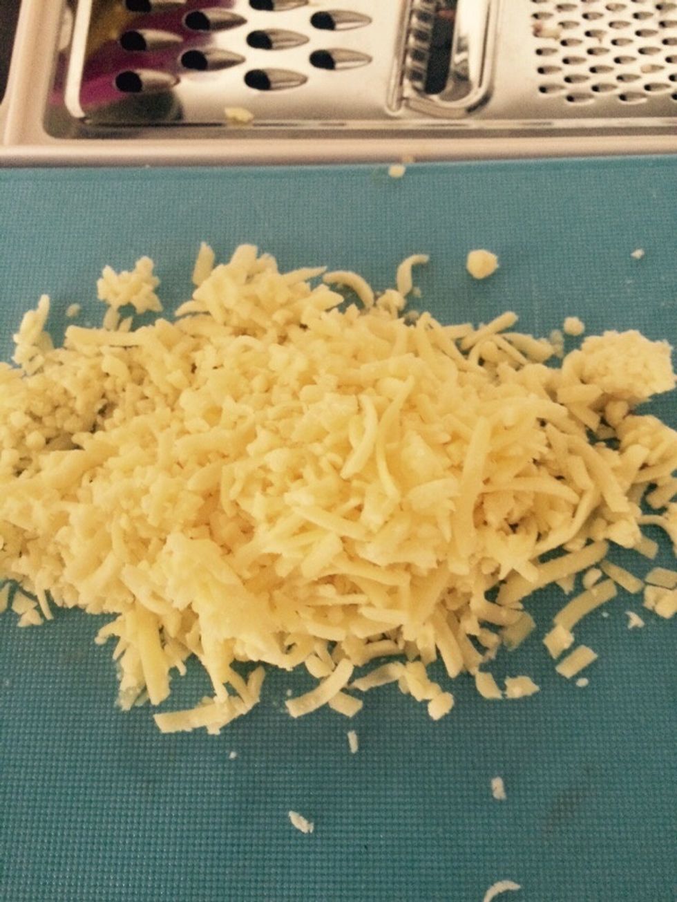 Grate some cheddar cheese