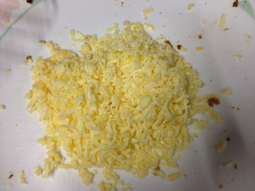 Grate some cheese while waiting for bread