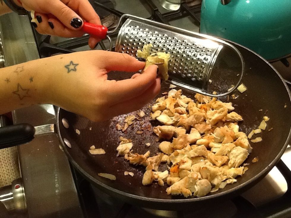 Grate some fresh ginger into the pan with your cooked chicken.