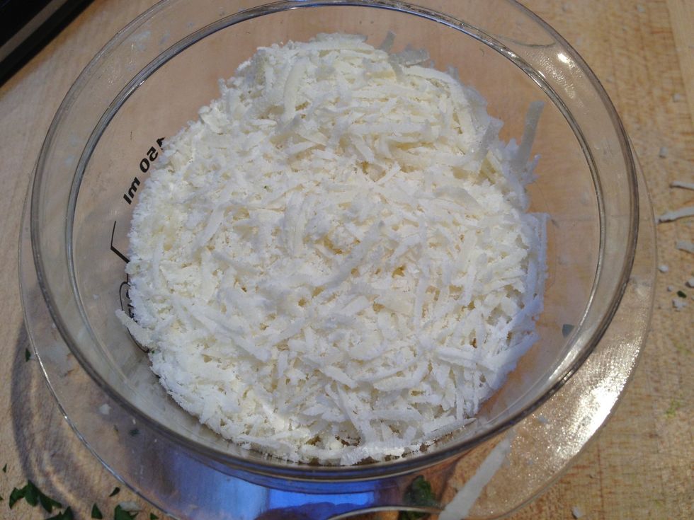 Grate some Parmesan cheese.