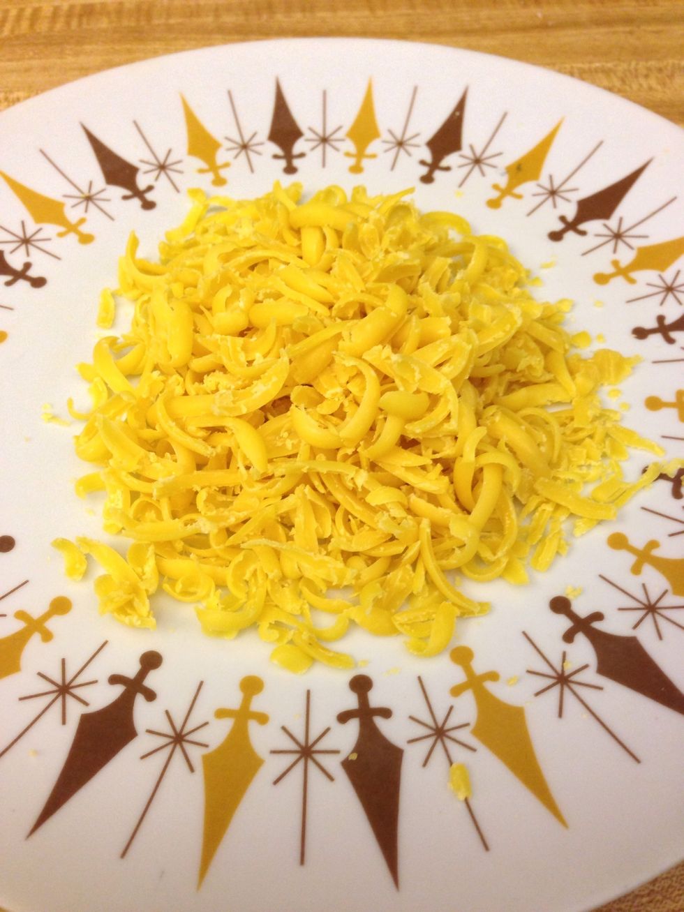 Grate the 1/3 piece until it looks like cheese.