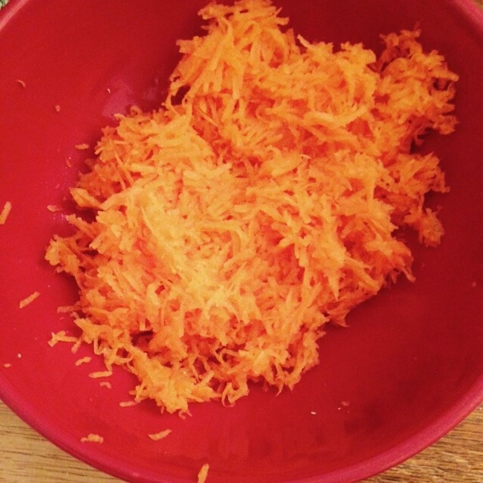 Grate the carrot in a bowl