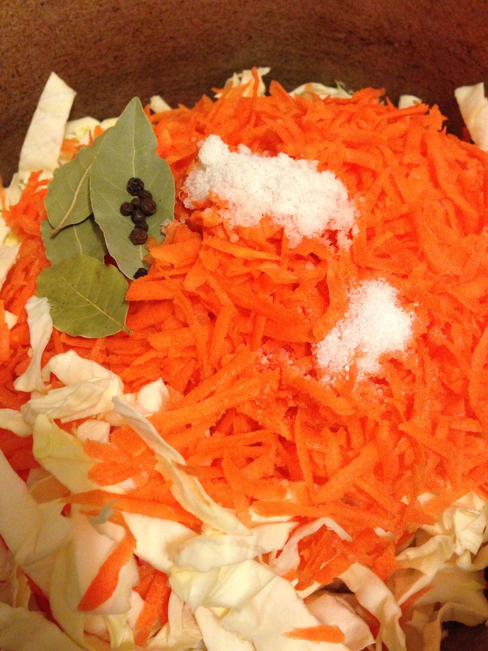 Grate the carrots, and add to the cabbage with all mentioned supplies. Sugar is optional - it just gives a better crunch to the cabbage, but it will be also good without sugar.