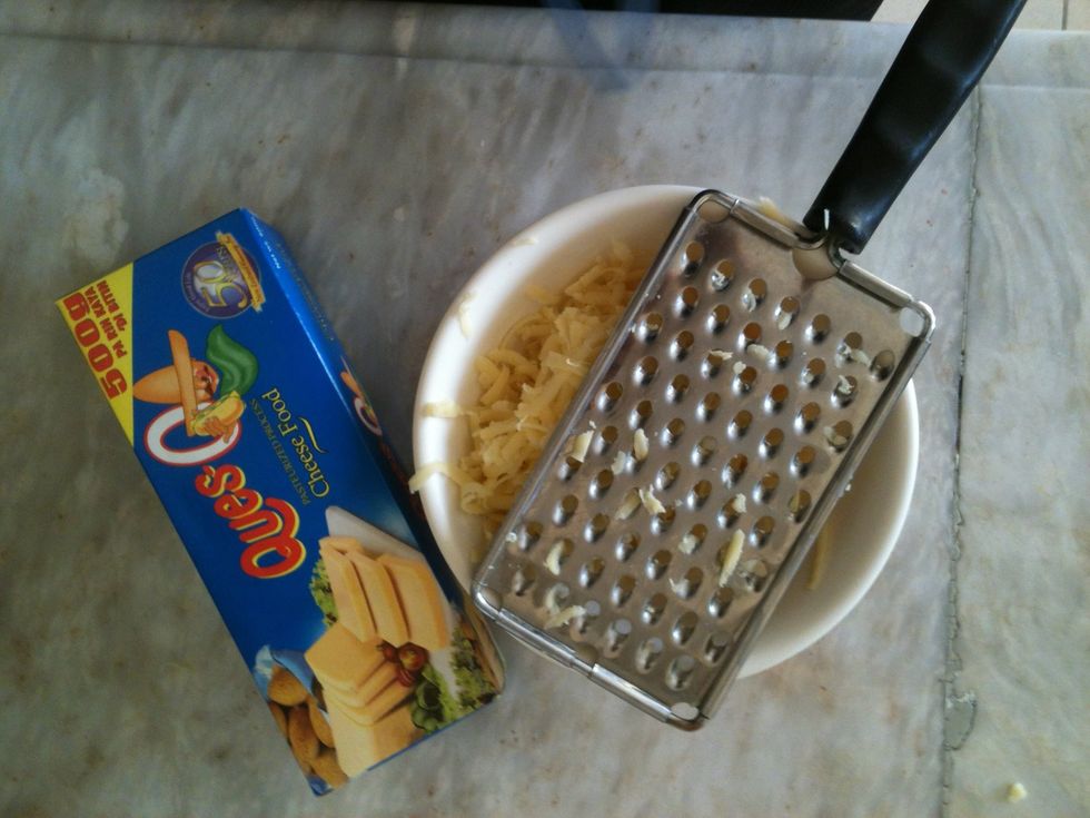Grate the cheese. I'm using an easy-melting cheddar, because it's easy to handle in the pancakes (and this is the one Tita always buys xD) Don't put it directly in the batter, just put it aside.