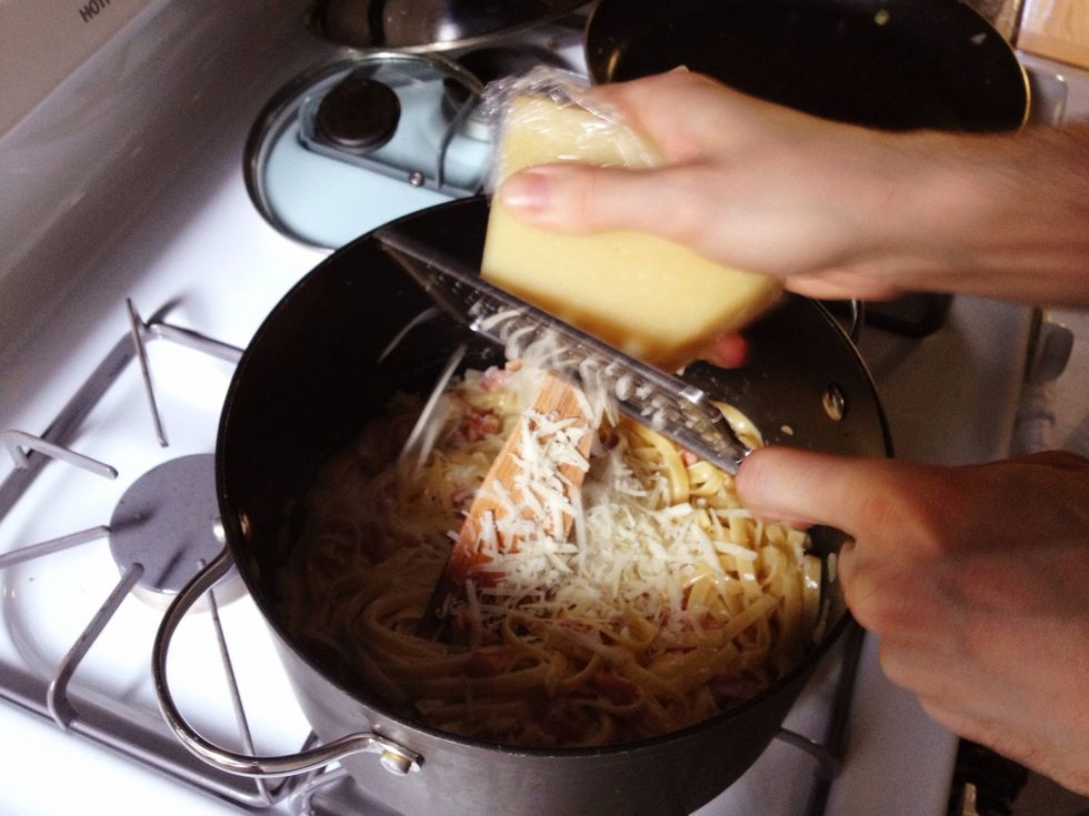 Grate the cheese into the pot.