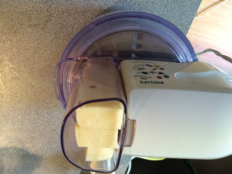 Grate the cheese (unless it is already grated).