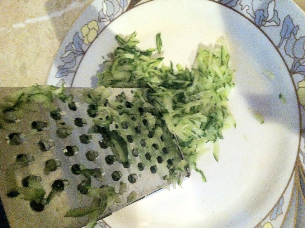 Grate the cucumber by using grater.
