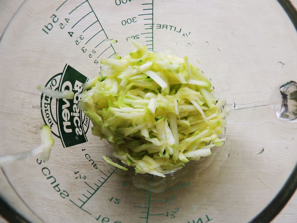 Grate the zucchini, add to blender or food processor with bananas, nut butter, cacao powder, chia seeds, protein powder and water. Blend until batter consistency. Put aside.