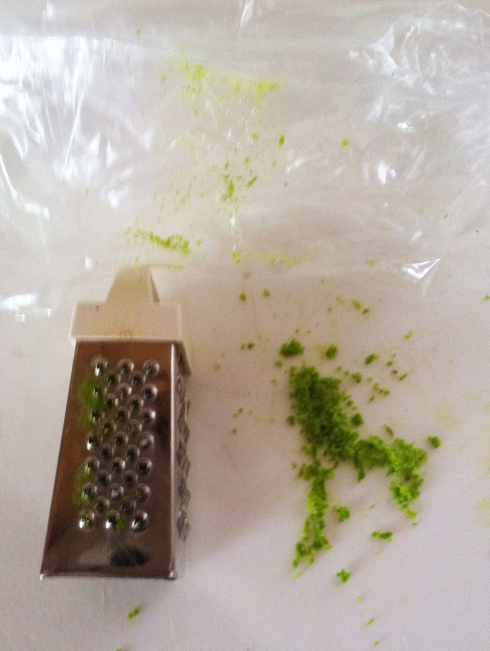 Grate using the smallest holes and with not too much pressure. Be careful not to shred the bag along with the lime rind.