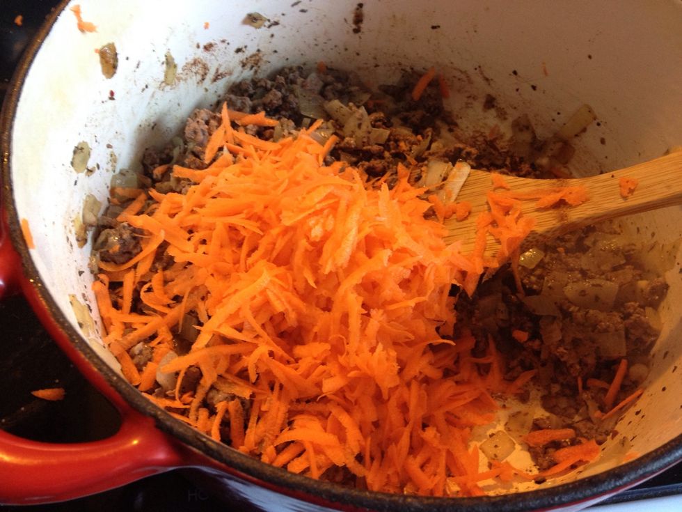 Grate your carrot straight into the pot. Don't worry about peeling it beforehand (waste of time and nutrients), just make sure you wash it first! Forgot to capture the capsicum, that can go now too.