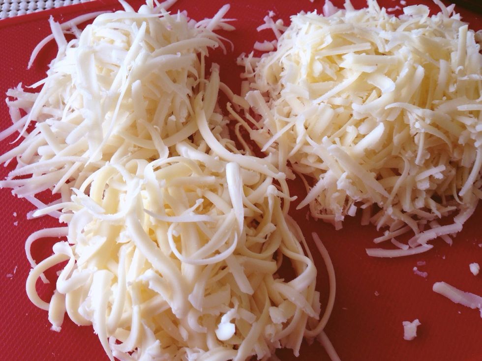Grate your cheese. Personally I had a mix of mozzarella, swiss and cheddar, but you can just pick your favourite or even buy store bought grated cheese if you wish.