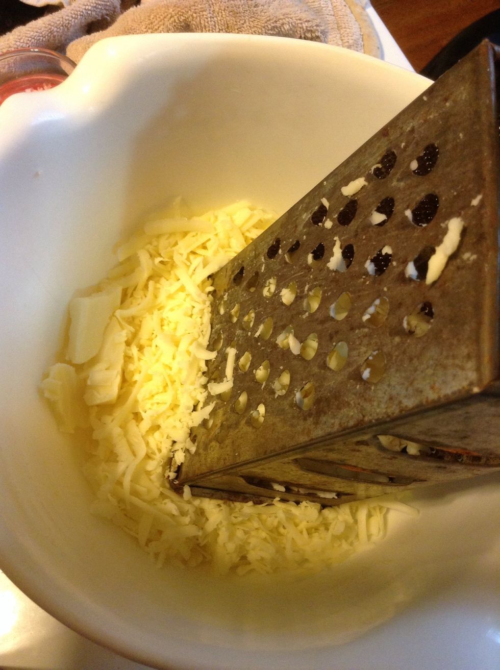 Grate your cheese while you have your pasta cooking according to package directions.