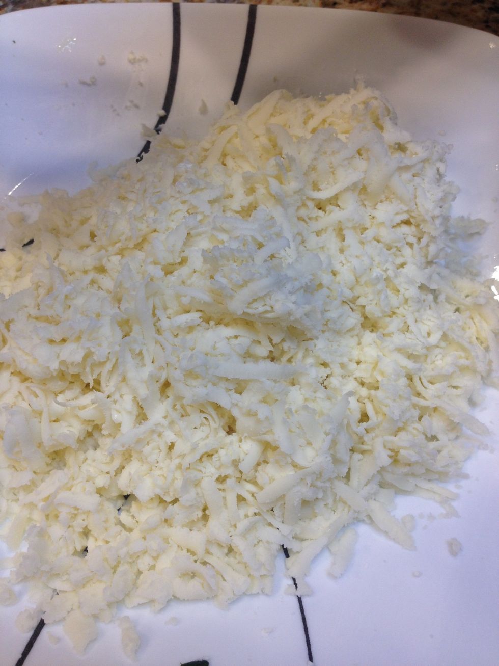 Grate your mozzarella, we used 1/4 of the one pound we had and put the rest in little baggies in the freezer