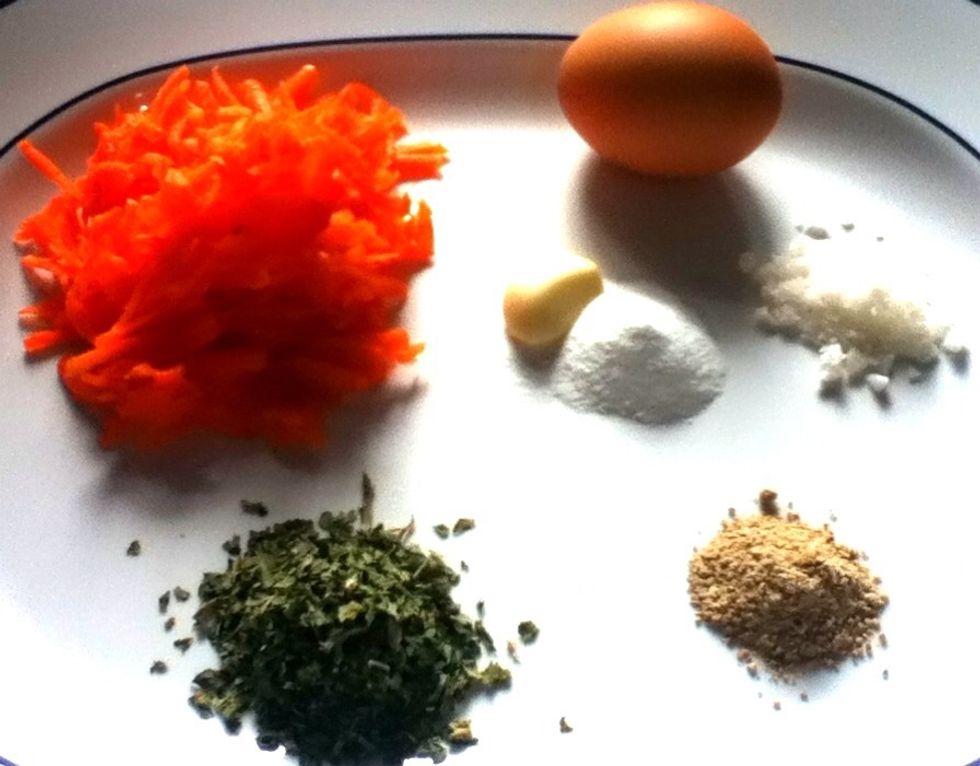 Grated 1 carrot, 1/2 cup of chunkie celery leaves (variations may vary), 1 garlic clove (grated), 1 egg, salt and pepper, garlic powder (to taste). You also may add some grated parmesan.