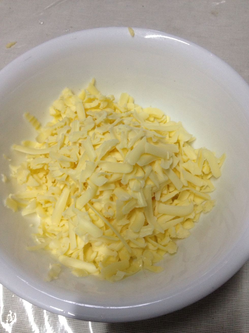 Grated cheddar. I grated half a block. I used what I had remaining on my fridge. Put the cheese in once the evaporated milk is bubbling in the pan