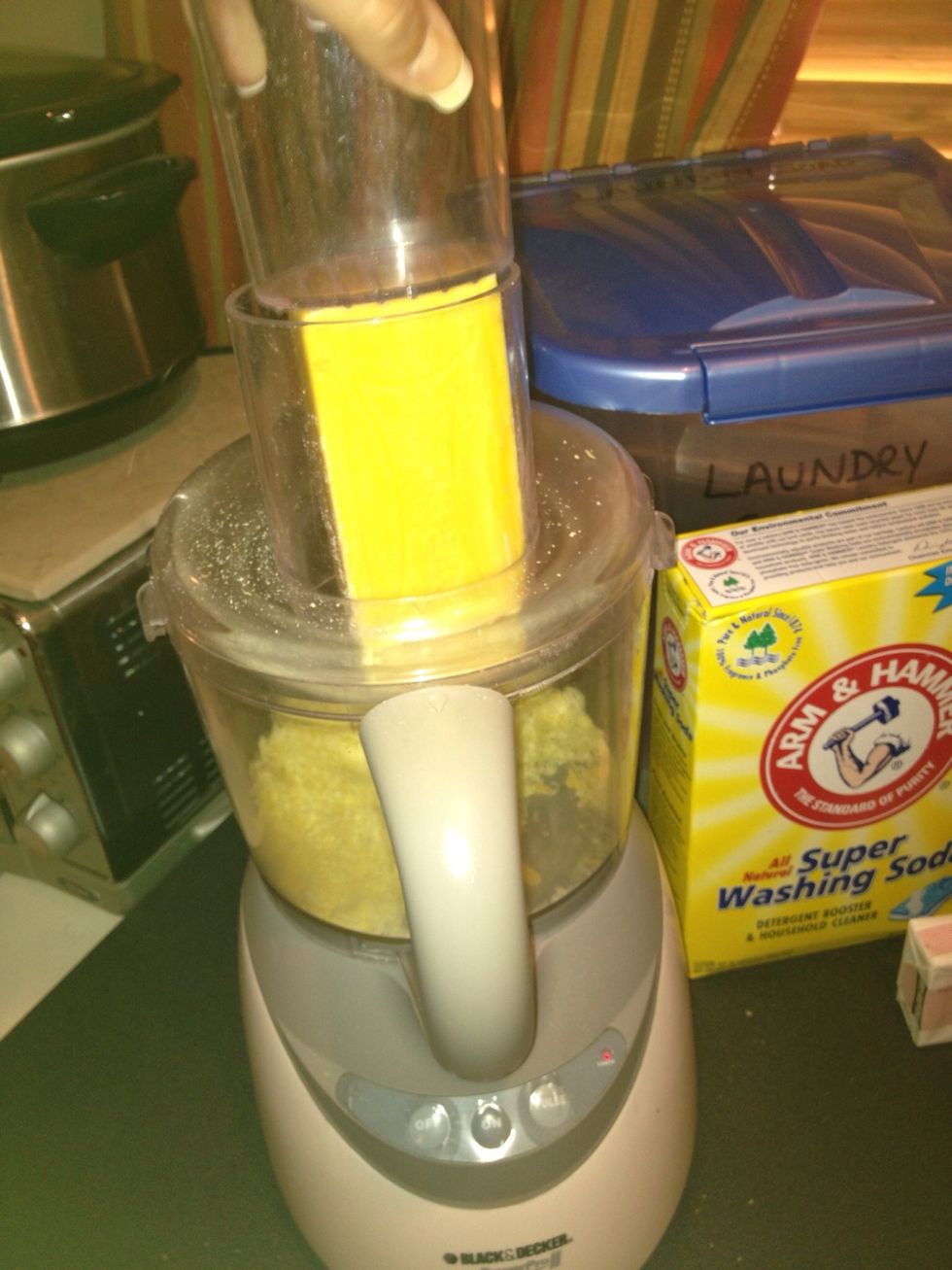 Grating the soap breaks it down into thin strips. Last batch I stopped grating after this step, but the laundry soap works better if the soap pieces are smaller.