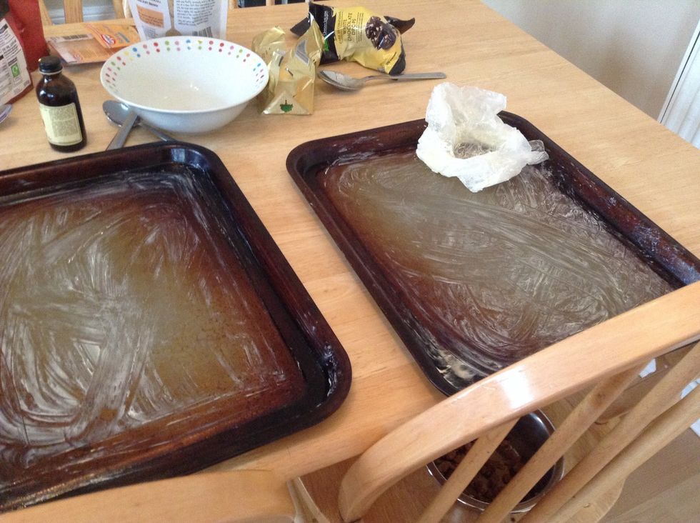 Grease 2 baking trays with butter