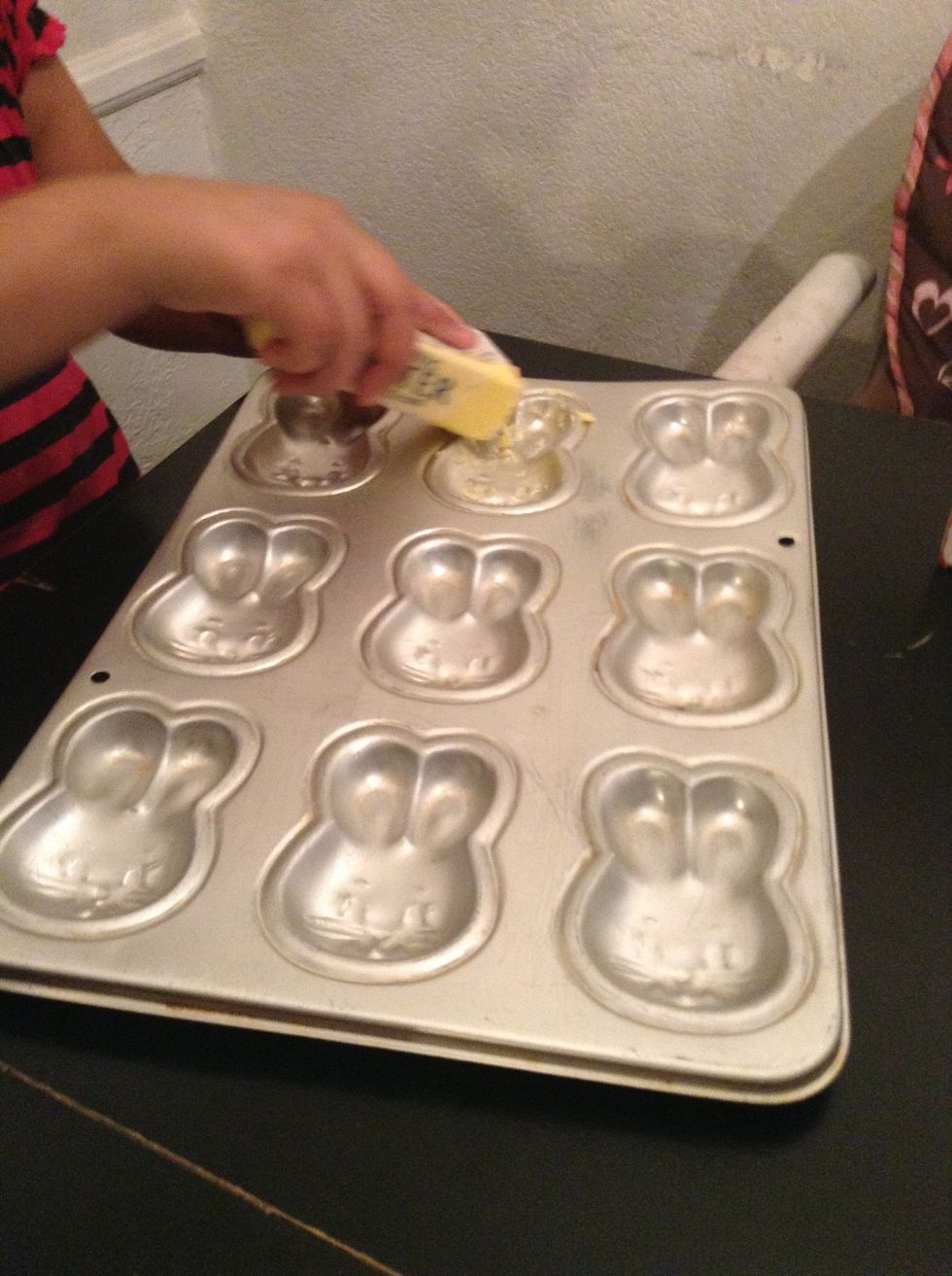 Grease 2 pans with butter.
