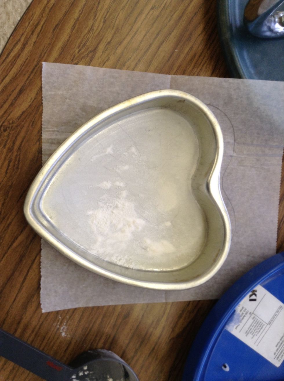 Grease a 8x8 pan then trace the shape out on a piece of wax paper flour the in side of the pan then place the cut out wax paper inside the pan