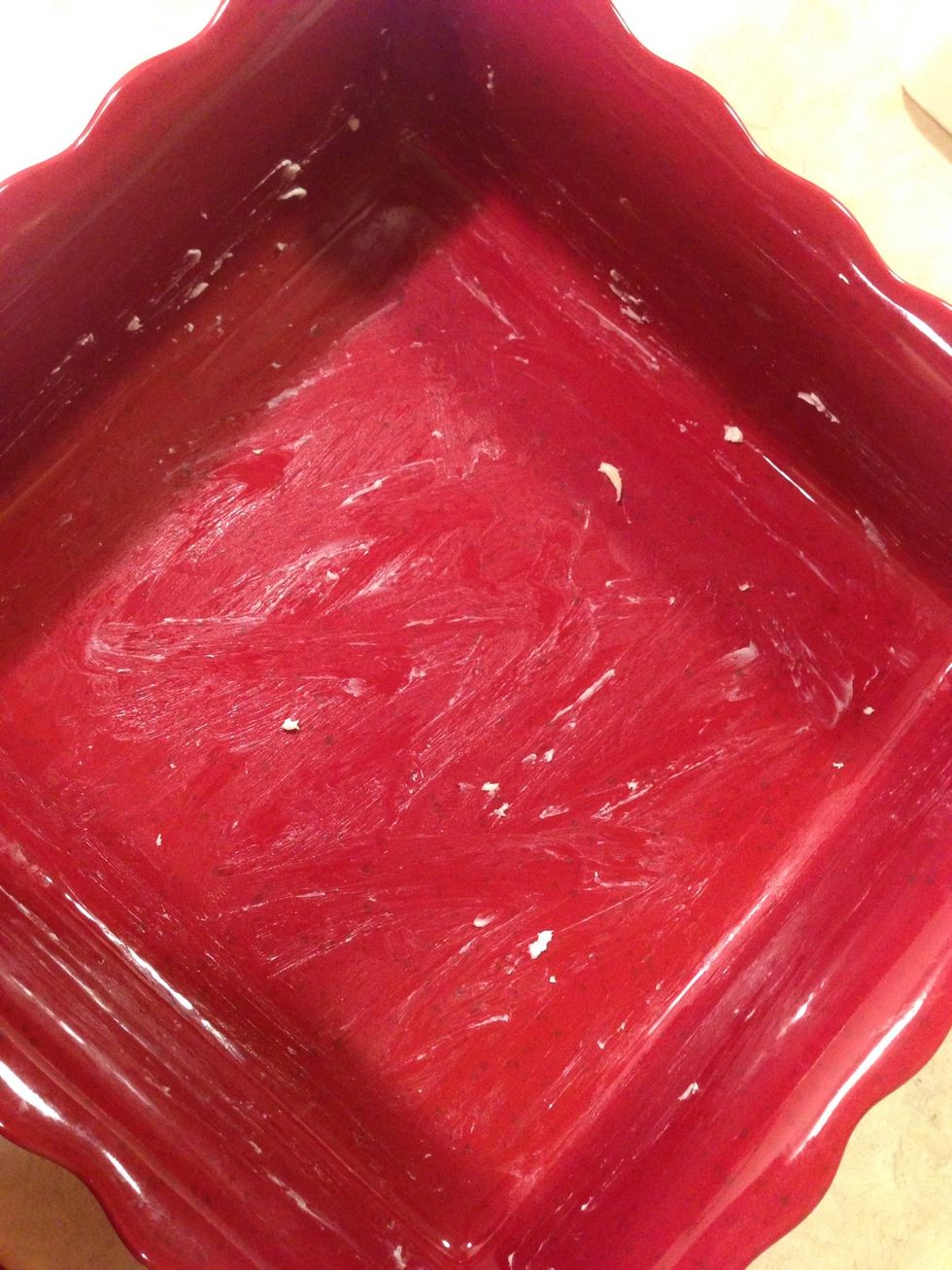 Grease a square pan with butter