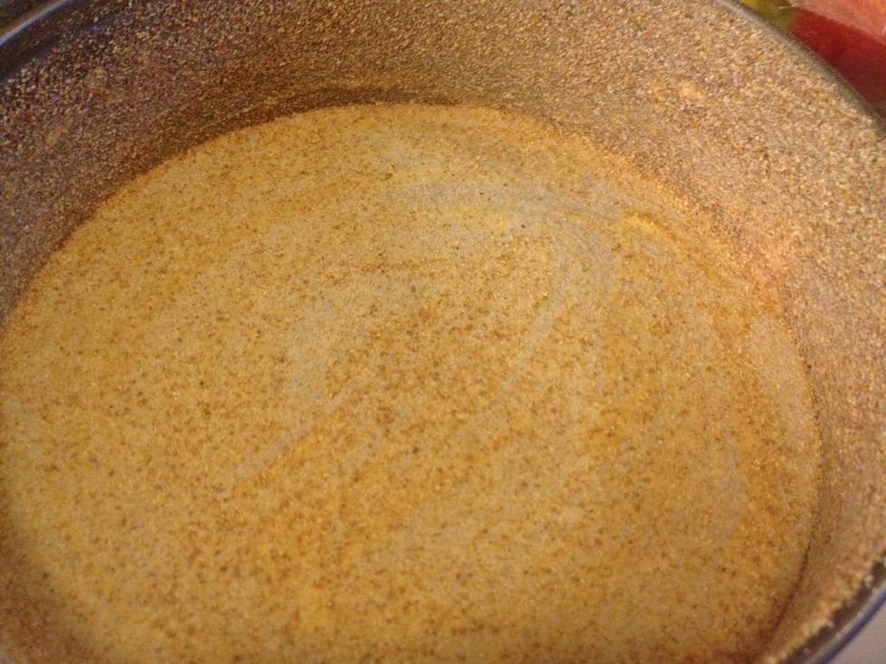 Grease and coat a cake pan.