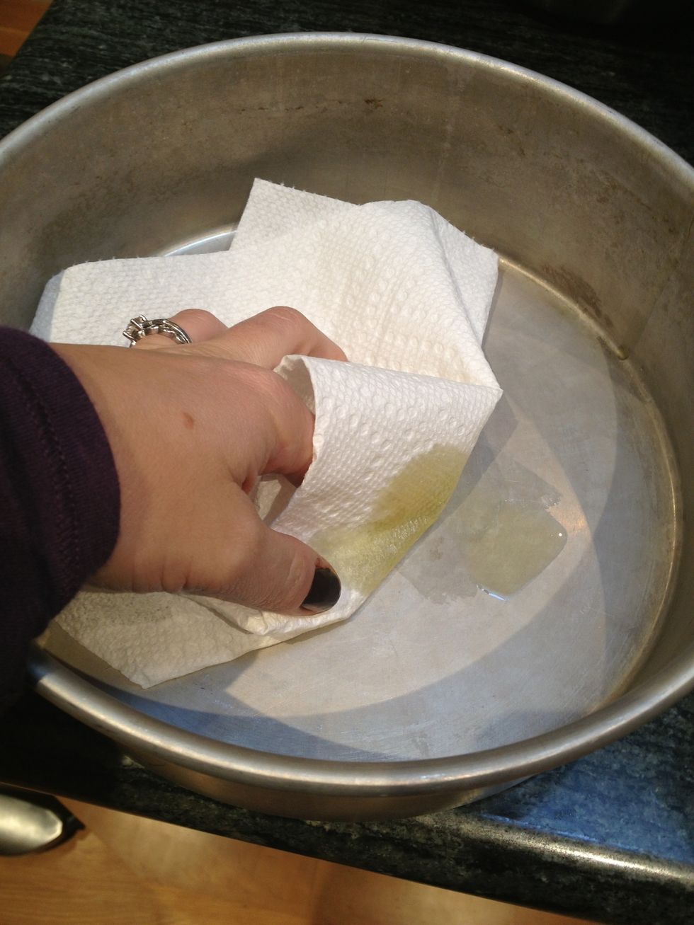 Grease and flour a 9-inch round cake pan. Place a parchment round at the bottom.