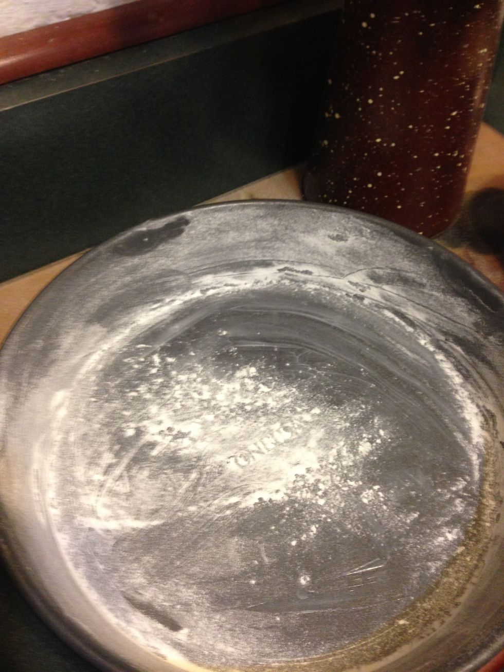 Grease  and flour two cake pans