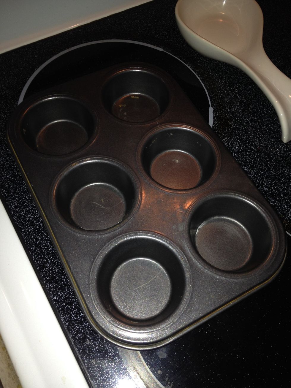 Grease cup cake/ muffin pan.