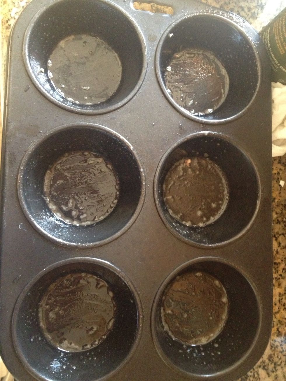 Grease cupcake pan with non stick cooking spray