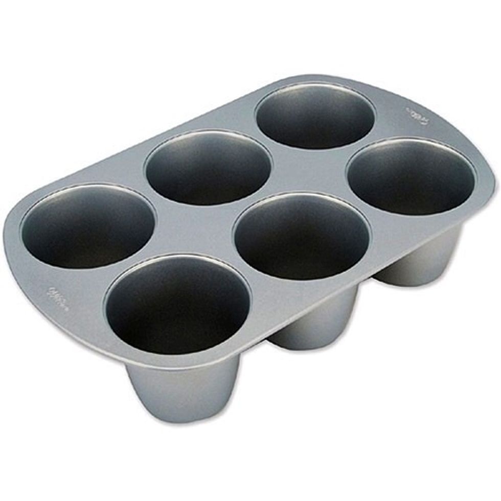 Grease muffin pans