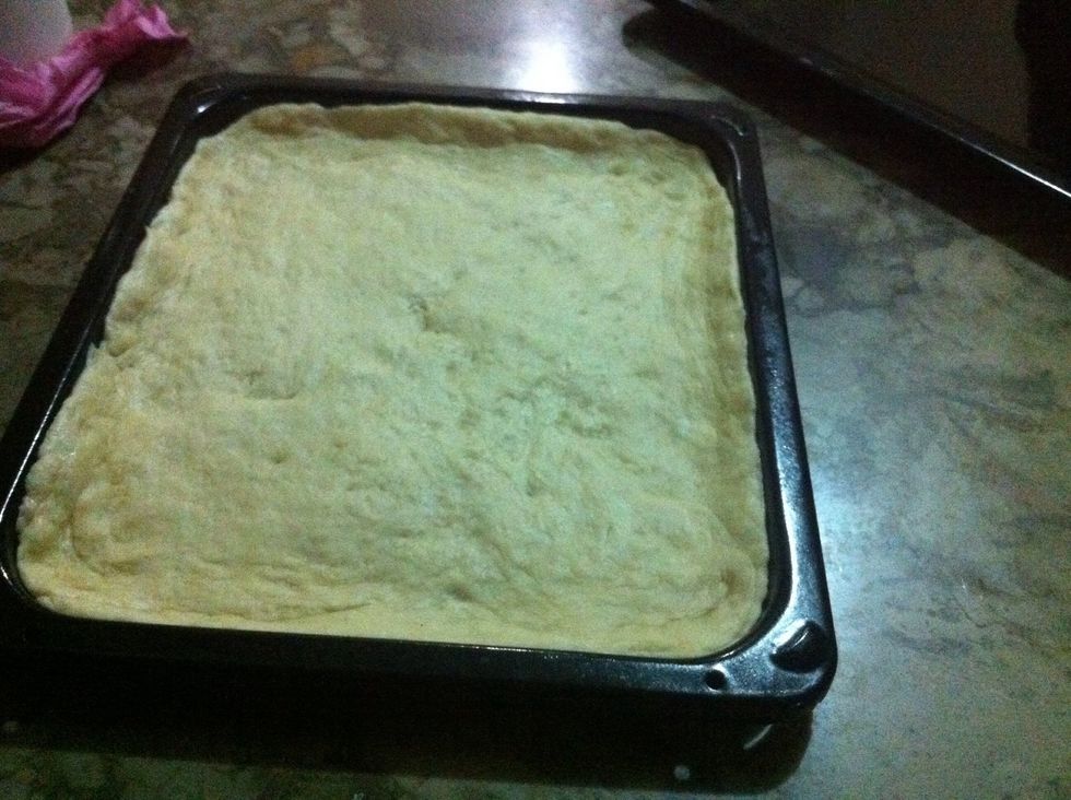 grease pan and spread dough on it