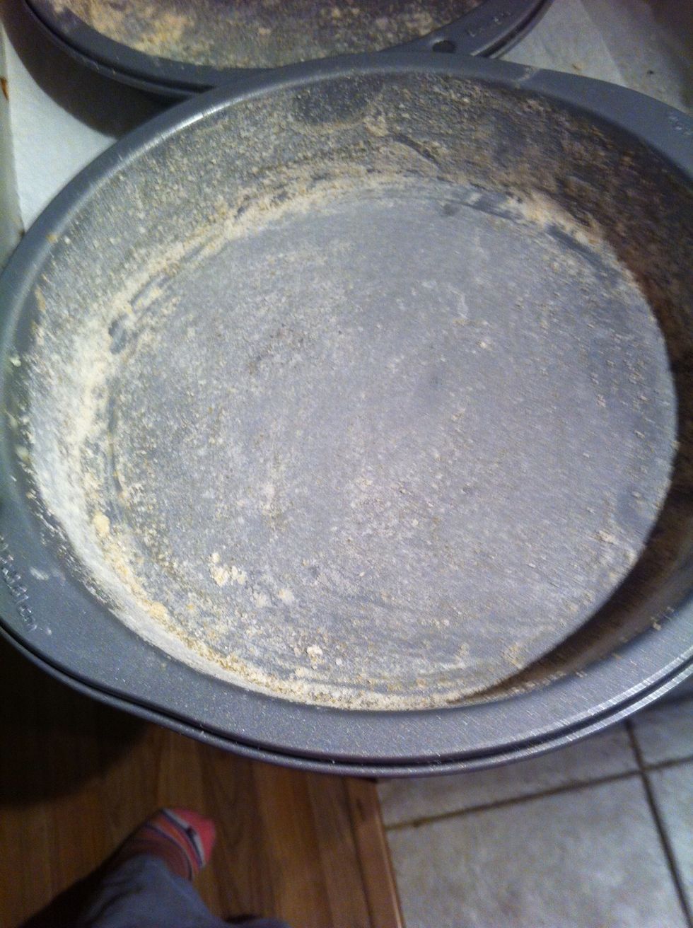 Grease pan(s) with margarine and then dust with flour