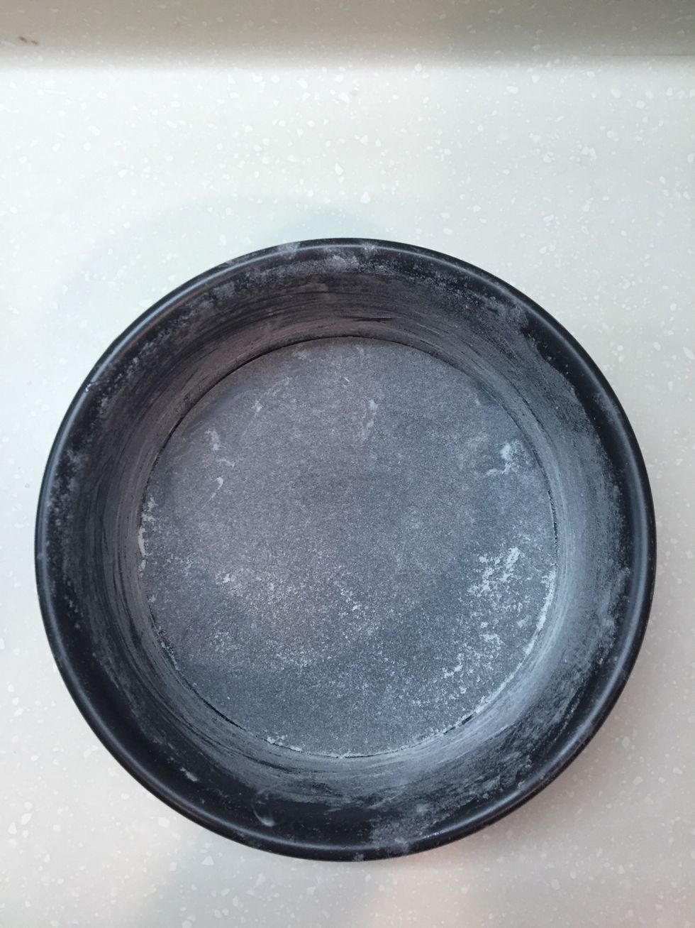 Grease the baking tin with butter and dust with flour to prevent the cake from sticking to the tin.  Here I use two 6" baking tins to make two small sponge cakes.