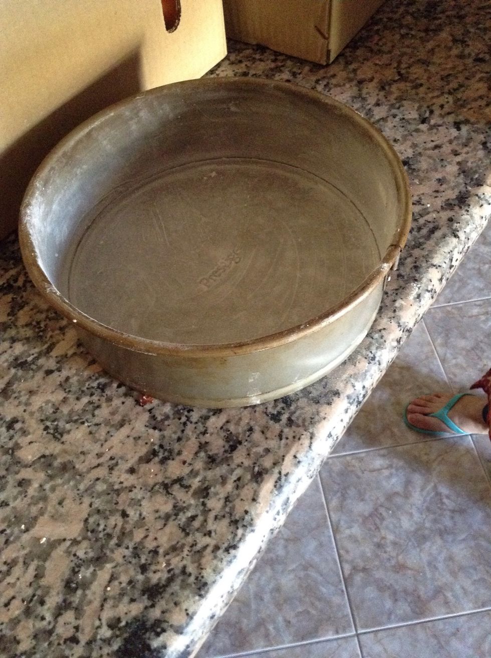 Grease the pan, It's better to take two pans in that way you'll save the pain of cutting into equal halves