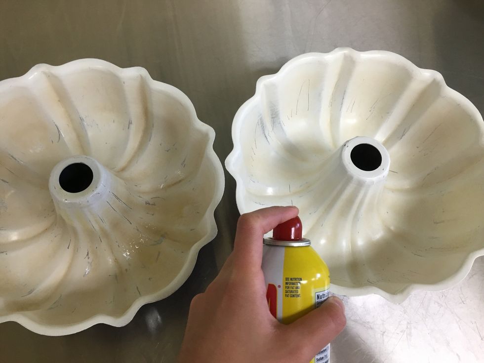 Grease two bundt pans with non stick spray