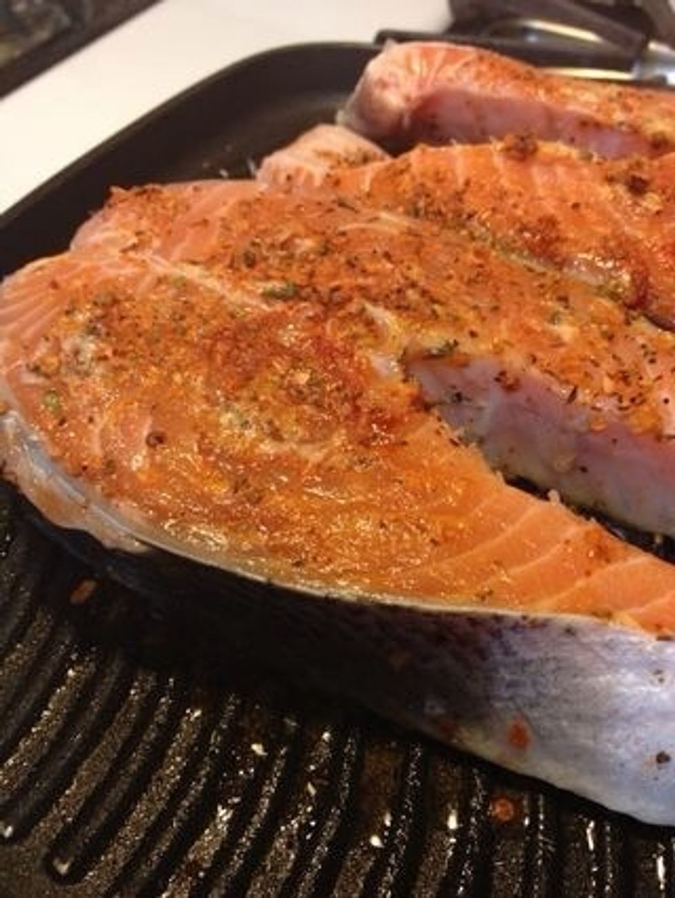 Grease your grill. Add some seasoning to it. I added Montreal smoke with smoked paprika on both sides.