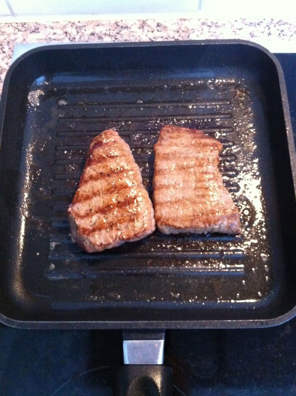 Grill steak. It depends on how you prefer your steak, I like mine medium. Add pepper and salt.