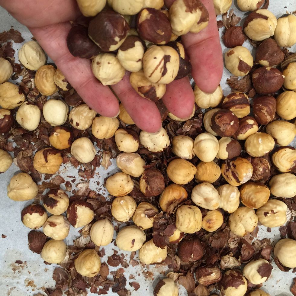 Grill the hazelnuts around 10 mins. Let cool down few minutes. Then rub them between the two hands or in a kitchen towel. Personally I like to keep some of the brown peel.